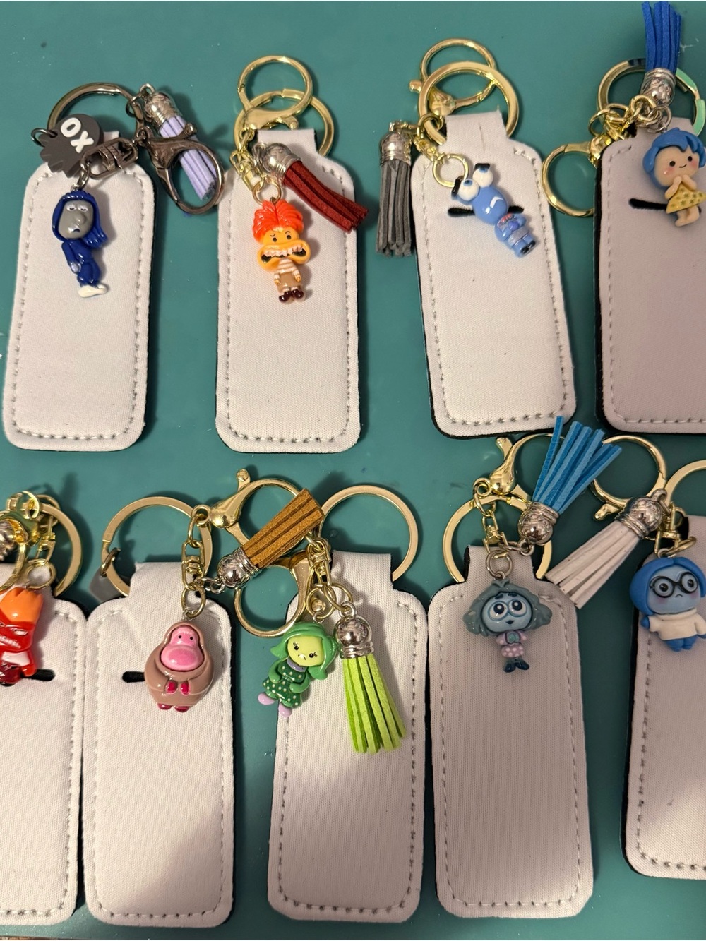White Lip Balm Holder Keychains with Inside Out 2 Character Charms